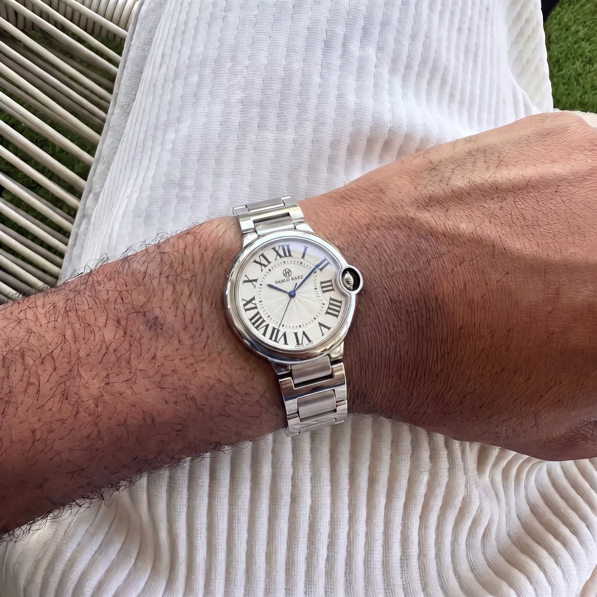Murray 36mm watch with polished stainless steel bracelet on a man's wrist #color_steel